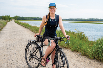 Kristine Keeney riding a bike along the Eastern Trail