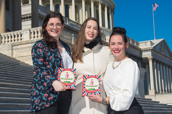 Three staffers from She Should Run on the steps of the US capitol