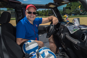 AU volletball coach Barry Goldberg sits behind the wheel of his Jeep