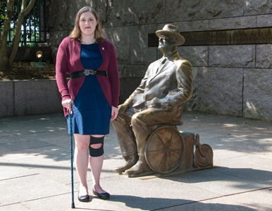 Sarah Blahovec stands next to FDR statue