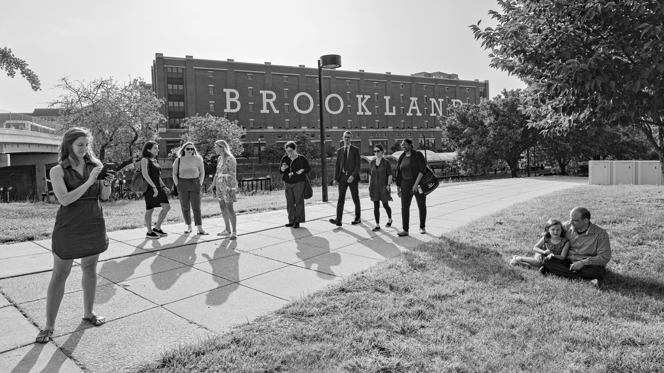 AU alumni stand near the Brookland Metro station