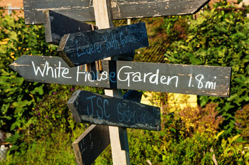 sign that says 1.8 miles to the White House garden