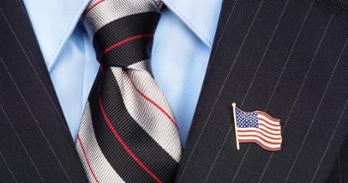 American flag lapel pin on a suit