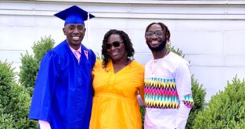Khalil Ibrahim (pictured left) poses with his mom and brother, Xavier, on graduation day.