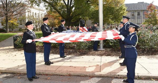 ROTC students hold the American flag during a Veterans Day ceremony at American University.