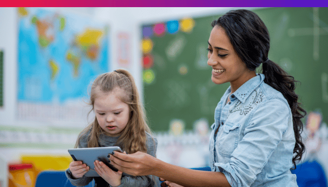 A teacher teaching a kid with a disability