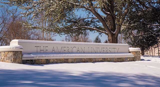 The American University gate covered in snow.