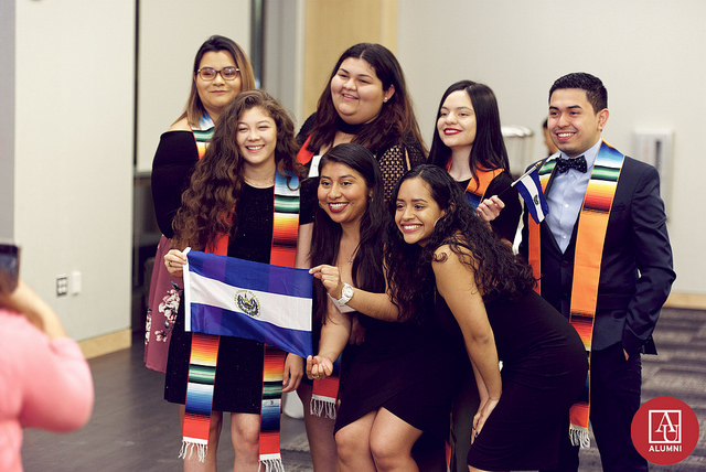 A group of students pose together after participating in the 2018 Latinx Gradution