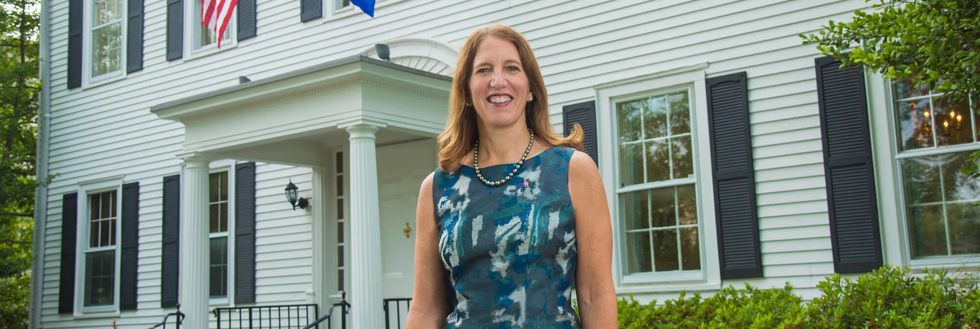President Burwell in front of the President's Office Building