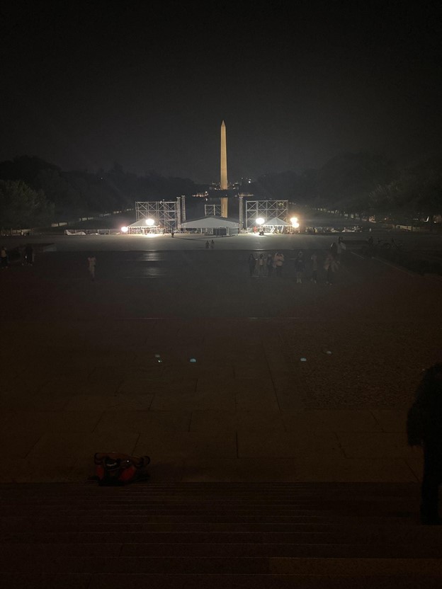 Photograph of the Washington Monument at night.