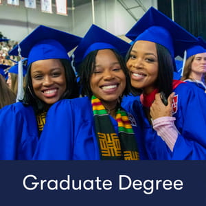 Graduate Degree: Three female students American University graduate students dressed in graduation regalia