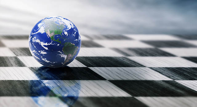 earth in marble shape rolling on a chessboard