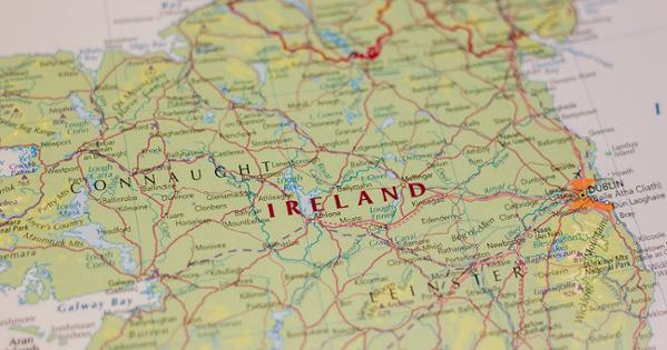 Closeup on a map of Ireland with a red line detailing the border between The Republic of Ireland and Northern Ireland.