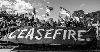 Protestors hold a sign that says "Ceasefire" during a protest in Washington, D.C.