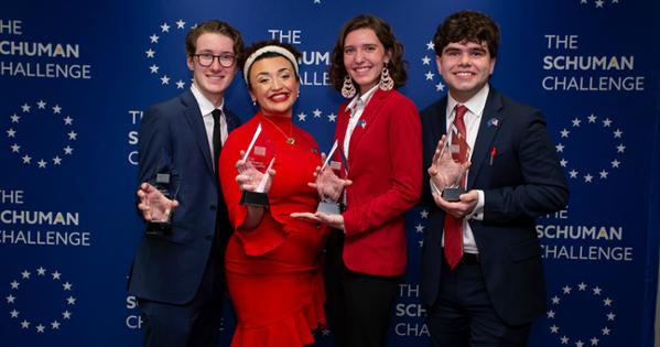 SIS students Josh Eliot, Gabby MacKay, Kevin Farmer, and Grace Roundcount pose with glass trophies after winning the Schuman Challenge.
