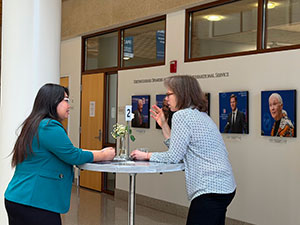 IPCR student Nora Nyi Myint talks with her former federal worker and mentor in that moment, Sheryl Stumbras
