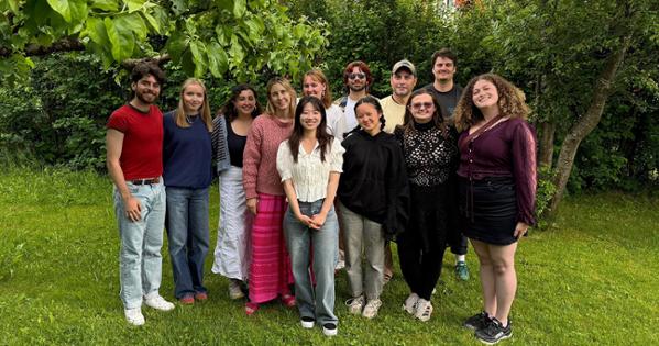Group photo of practicum students outside on the grass