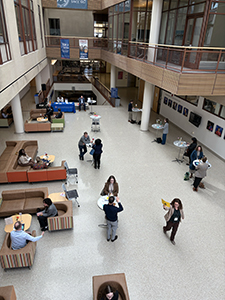 overhead shot of mentors and mentees meetings and talking in the atrium of the SIS building