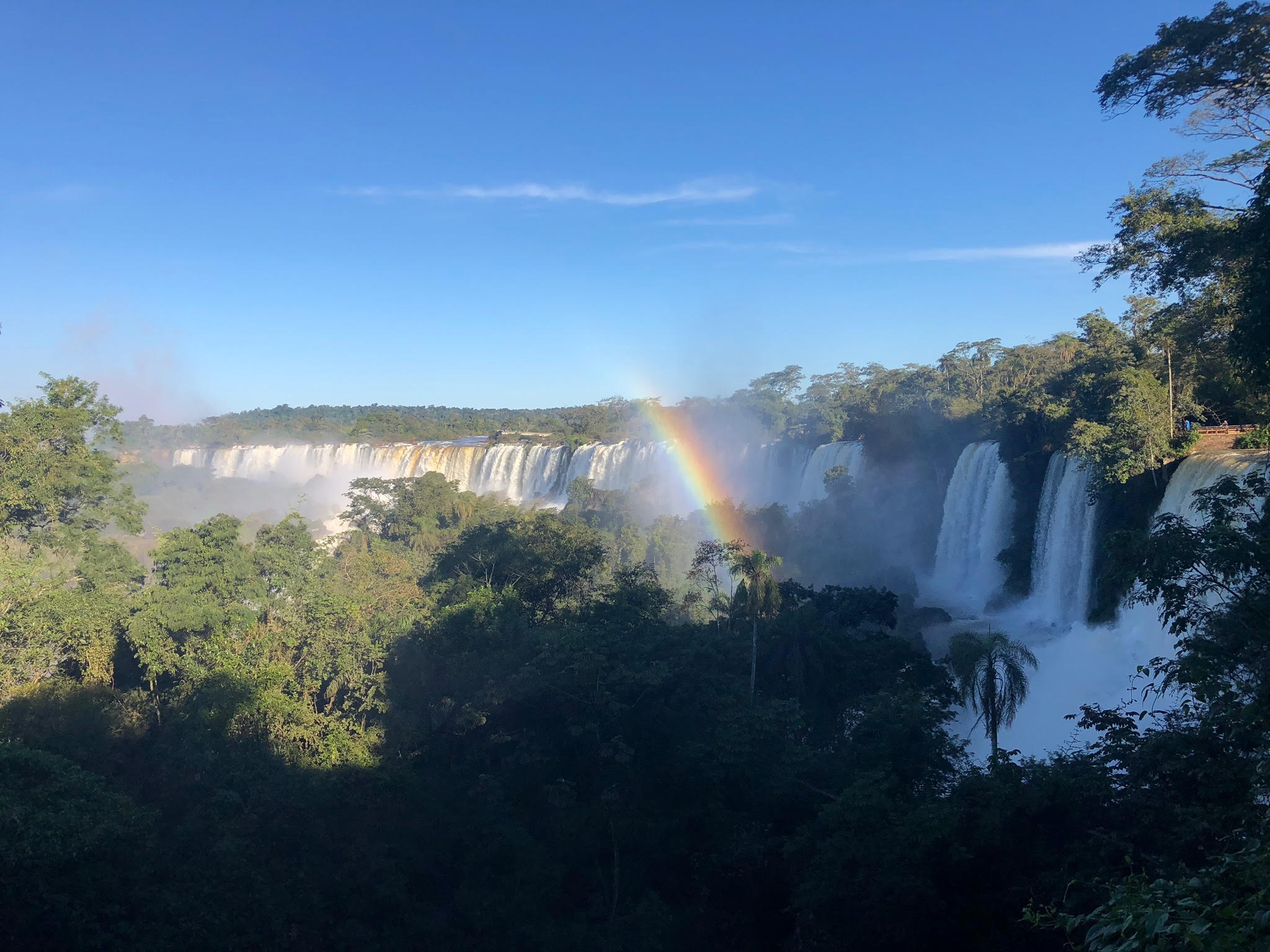 Large waterfall with a rainbow in the middle of the photo