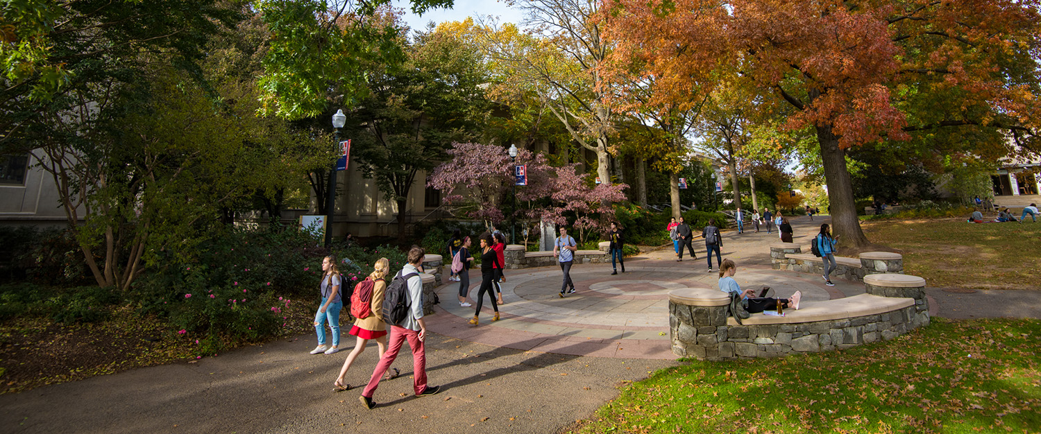 Students walk between classes on AU's campus on a beautiful fall day.