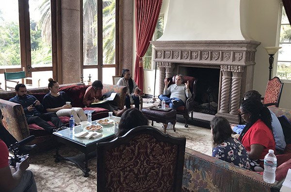 Adam Goodman meets with L.A. Intensive participants in the AU West mansion.