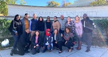 Members of the EdD Cohort 1 pose in front of the American University entrance.