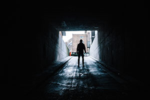 person standing in tunnel