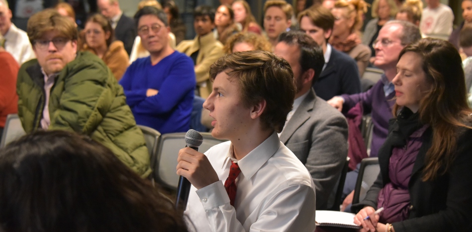 Student asking question at event