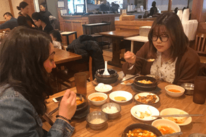 Katherine with her roommate at a Korean restaurant