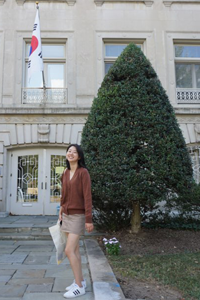 Jiyoun standing in front of the South Korean Embassy