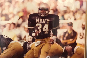 Man in Navy football uniform