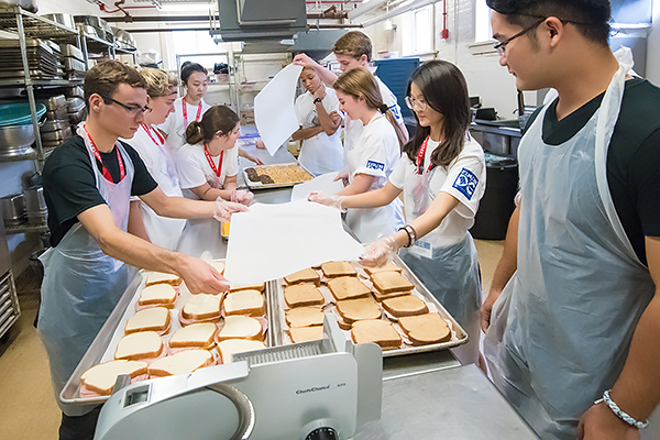 students make sandwiches at House of Ruth