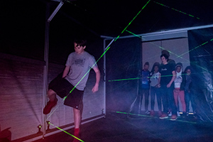 student navigates laser maze