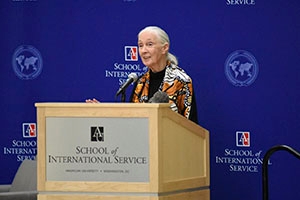 Jane Goodall speaks behind School of International Service podium.