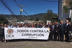 Group holding anti-corruption sign