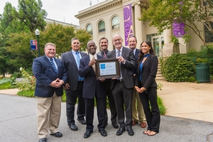 American University staff stand in front of Batelle-Tompkins building with ENERGY STAR certification