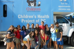Studnts in front of Children's Health Project of DC bus