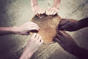 Hands holding an empty bowl