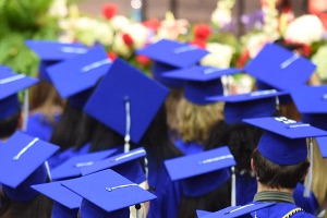 Blue graduation caps worn by American University graduates.