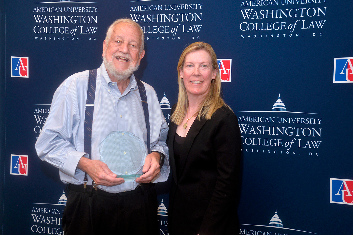 Professor Steve Wermiel with his Excellence in Teaching Award standing with Interim Dean Heather Hughes. Professor Steve Wermiel with his Excellence in Teaching Award standing with Interim Dean Heather Hughes.